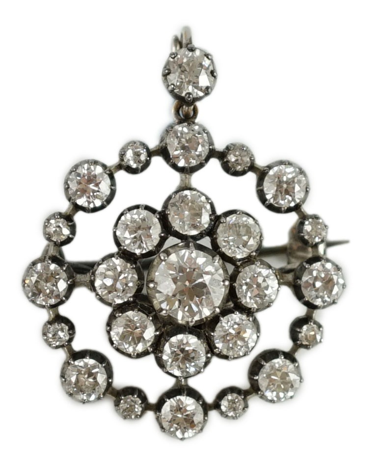A Victorian gold, silver and diamond cluster set target pendant brooch